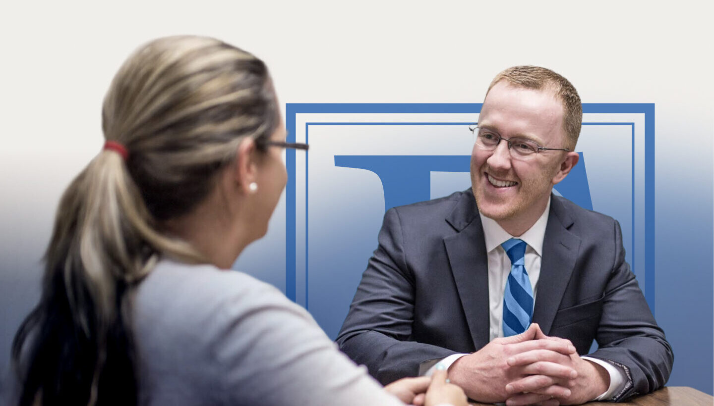 Attorney Christopher Earley meeting with a client